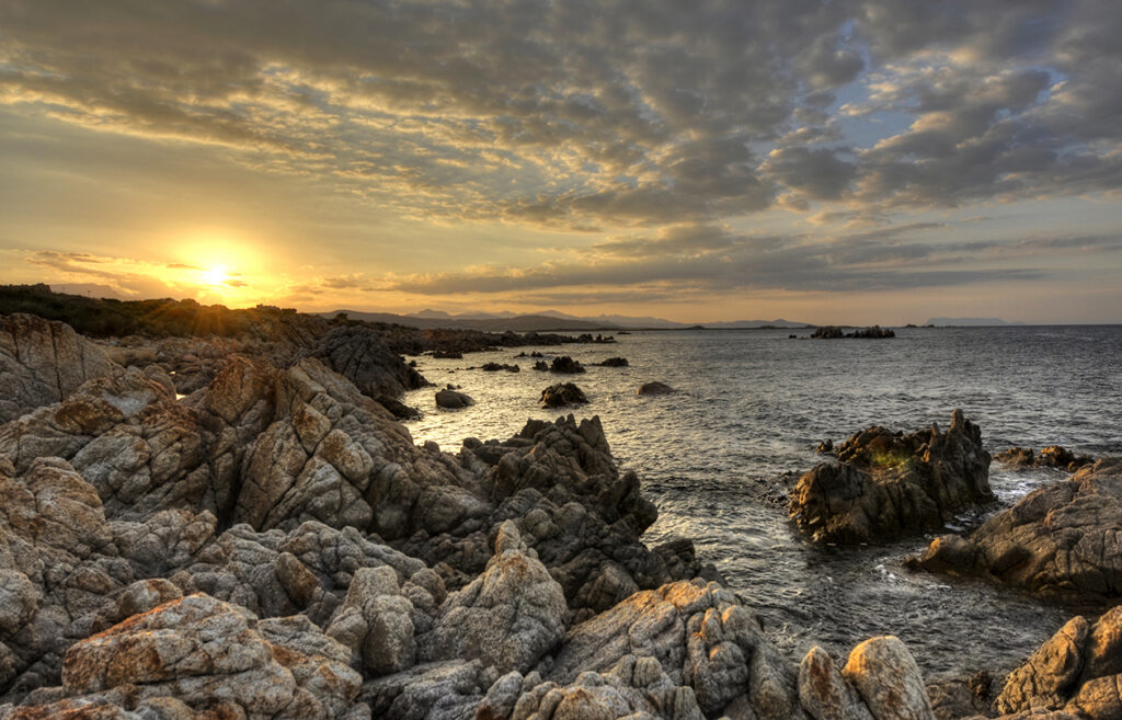Veduta dalla scogliera di Capo Comino con l' isola di Tavolara sullo sfondo.