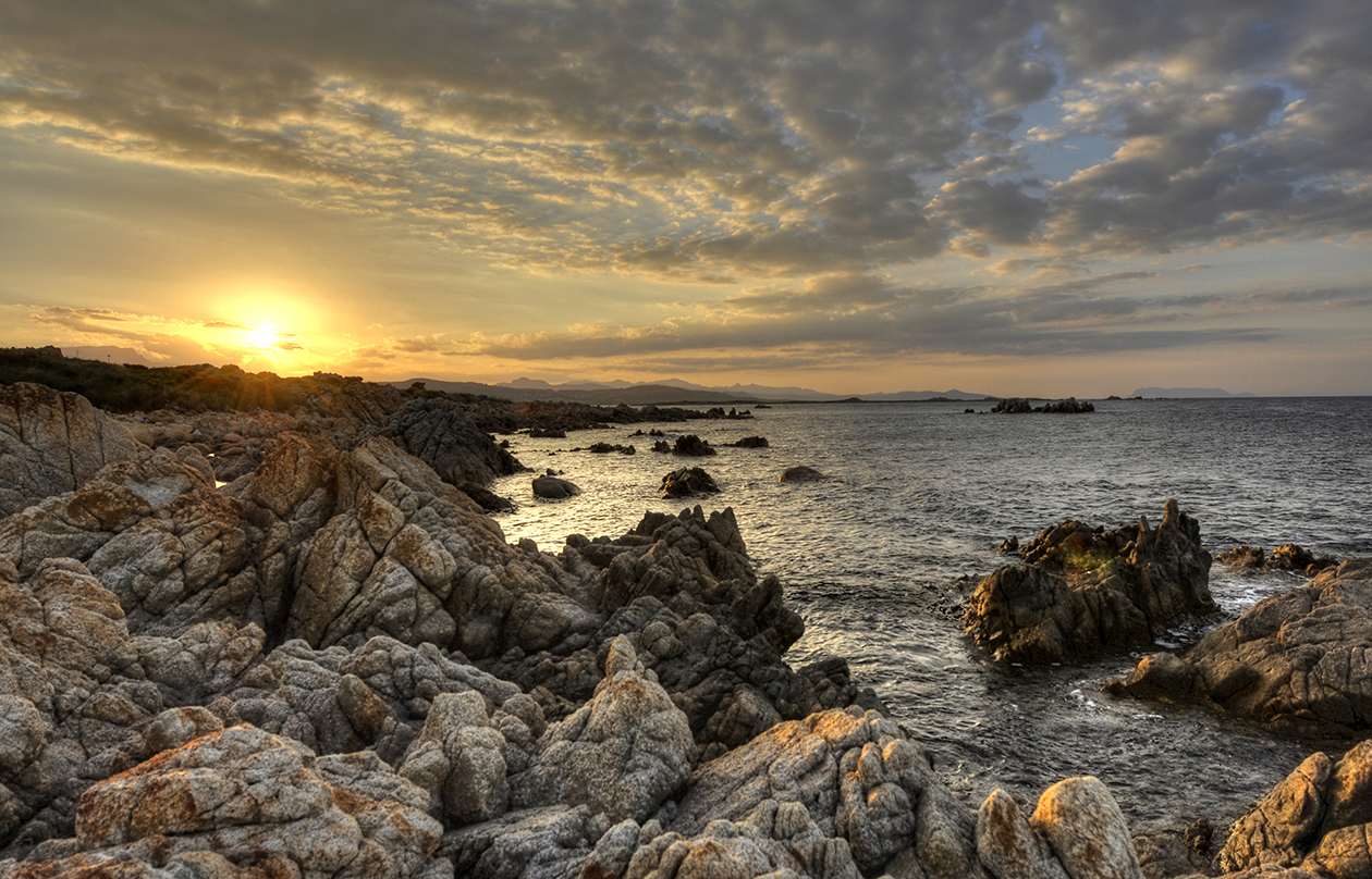 Veduta dalla scogliera di Capo Comino con l' isola di Tavolara sullo sfondo.